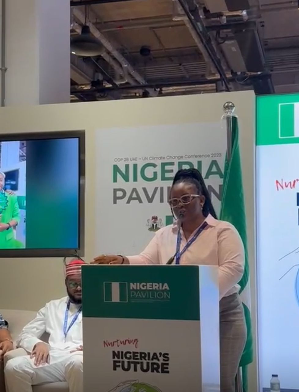 Founder speaking at Nigeria Pavilion podium, COP28